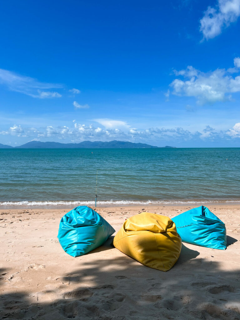 Beanbags on a beach in Koh Samui on a sunny day