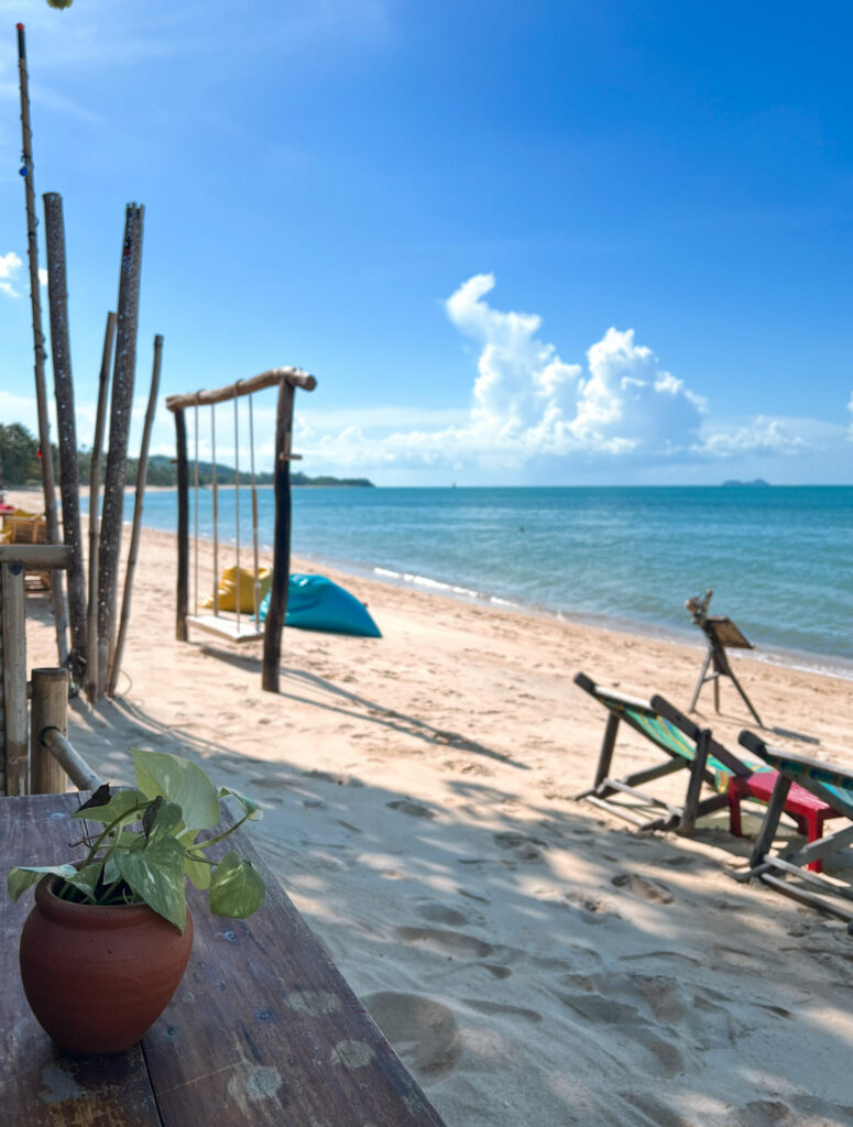 Chairs on the beach in Koh Samui on a sunny day