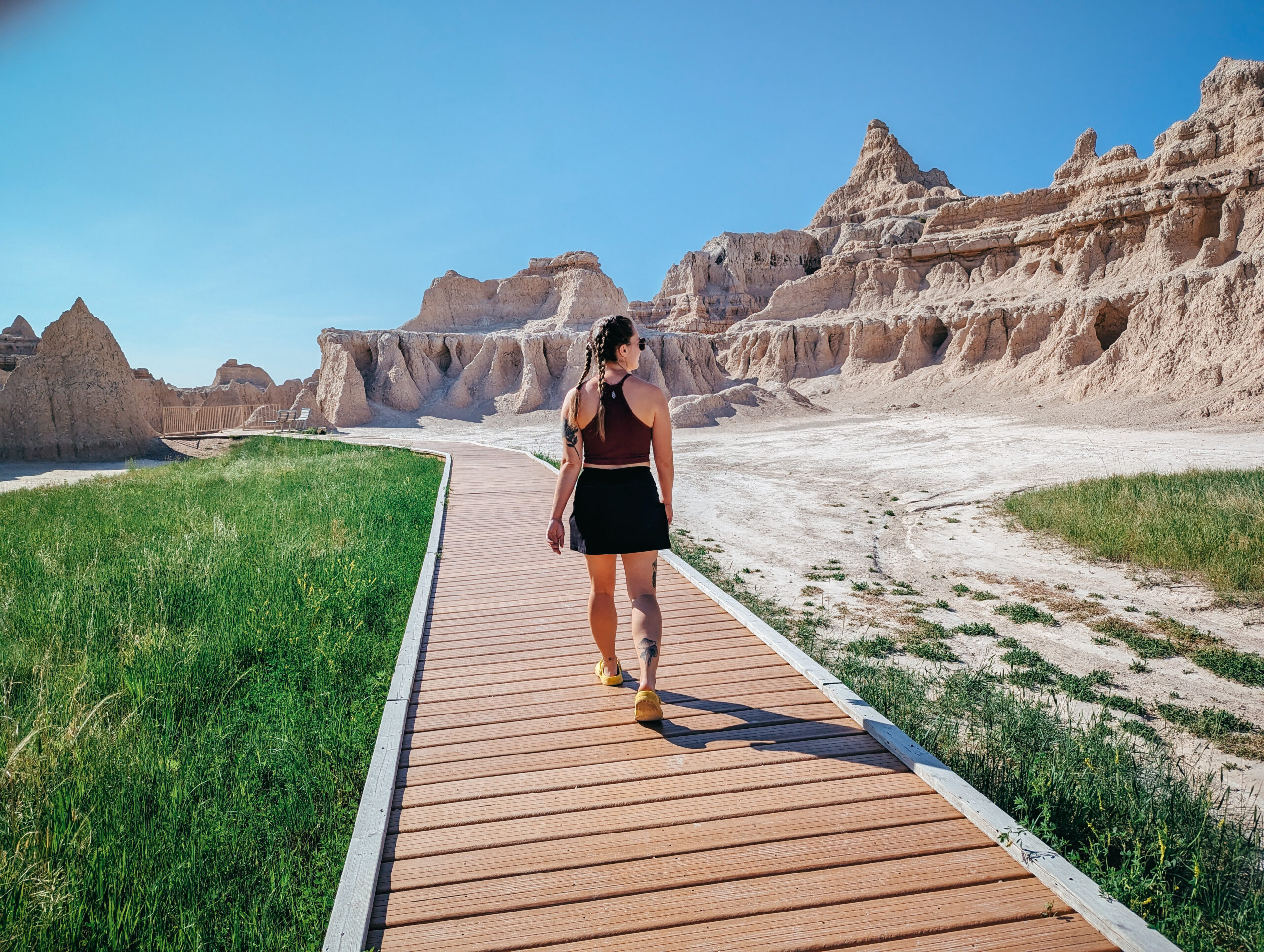 A woman walking on a board walk in Badlands National Park