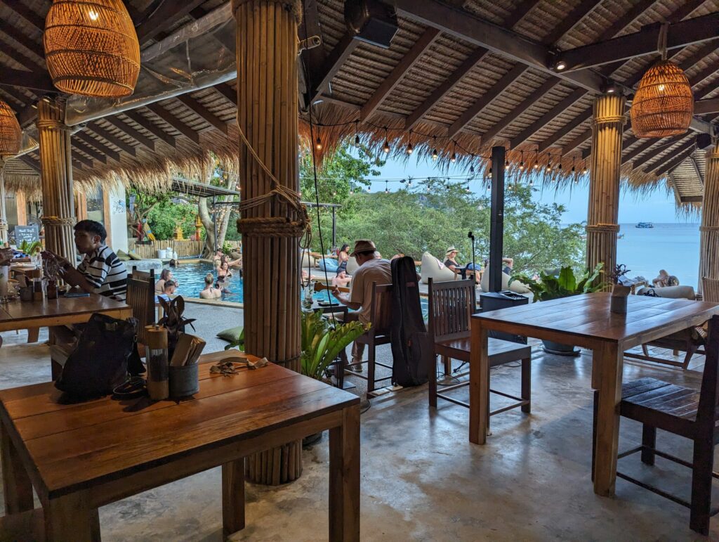 A picture of the tables and pool at Koppee Cafe in Chalok, Koh Tao