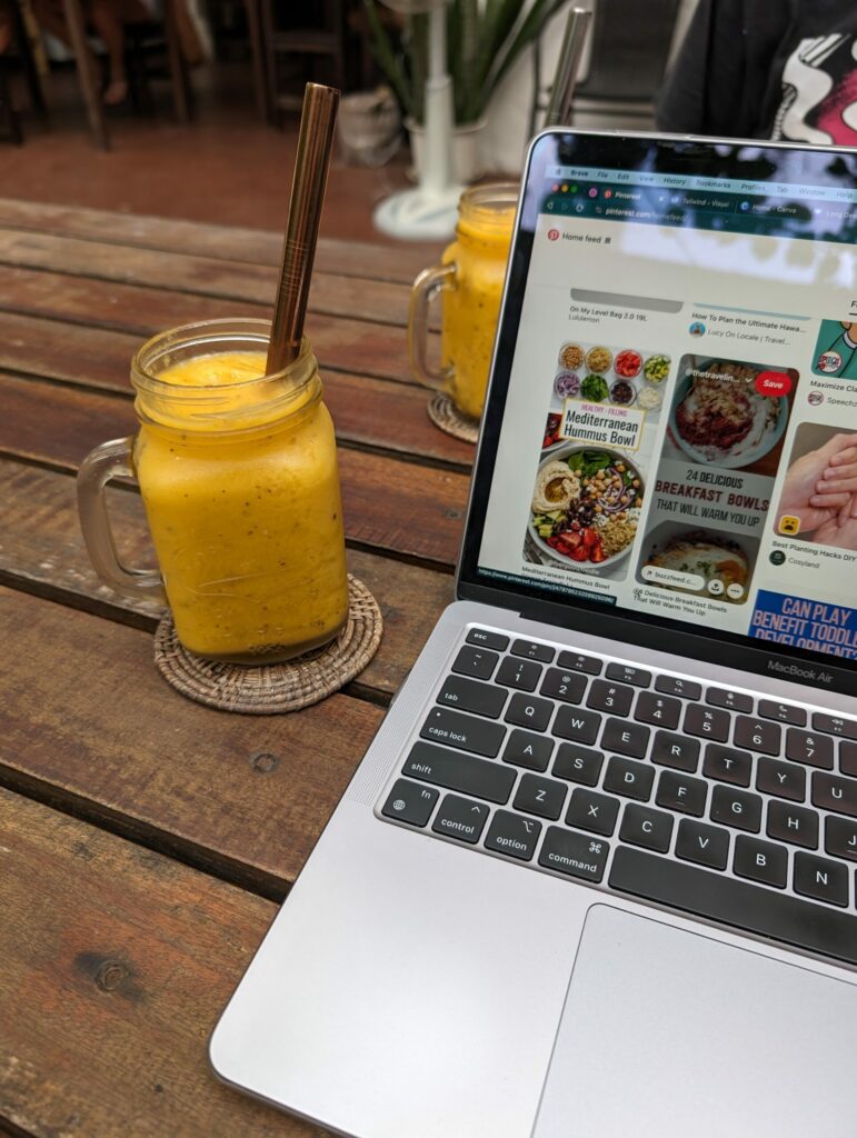 A snapshot of my laptop featuring a mango smoothie from Black Tip Coworking Cafe in Koh Tao