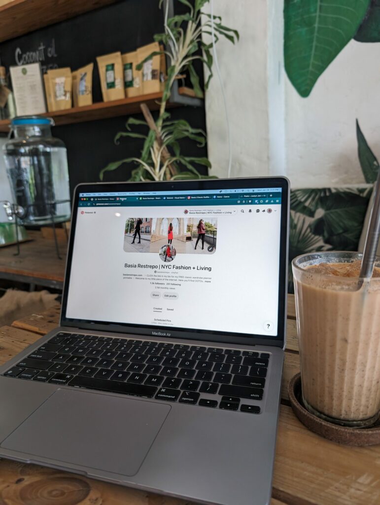 A snap of my laptop open to a Pinterest screen in a cafe with an iced coffee.