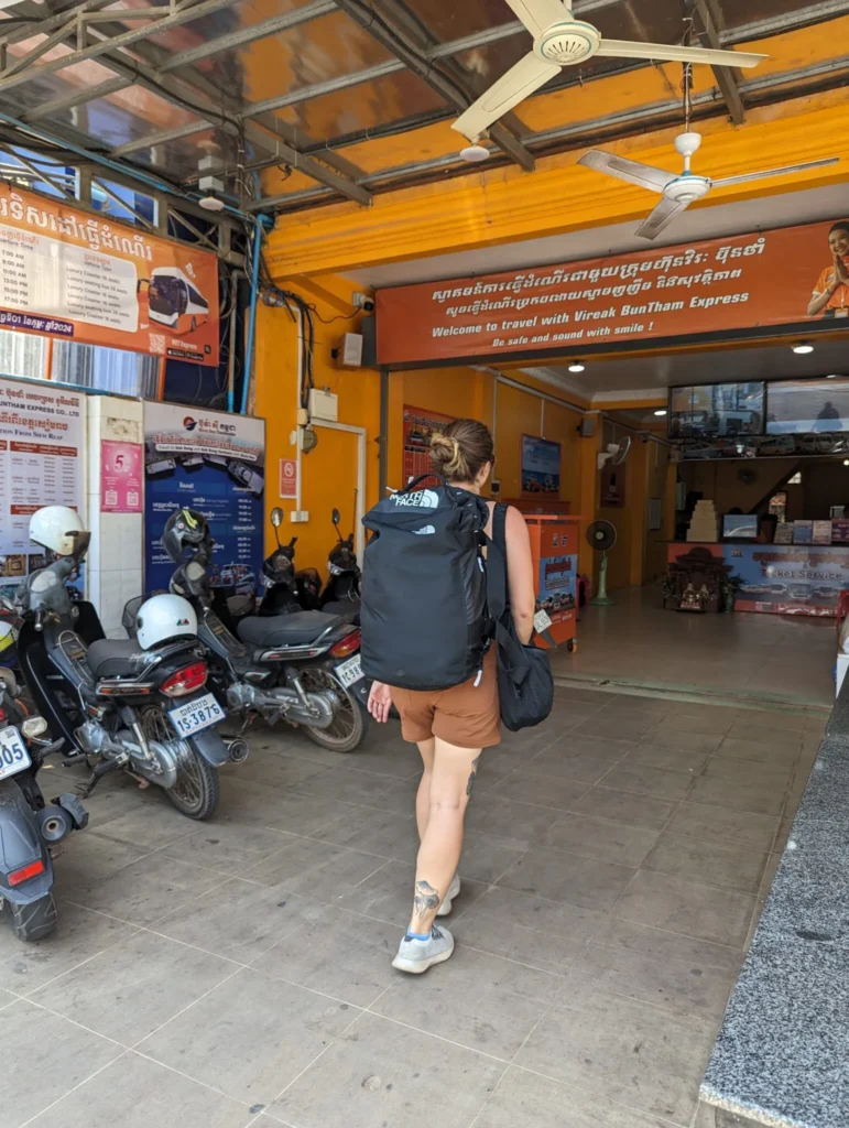 Justyn walking into the bus station in Siem Reap.