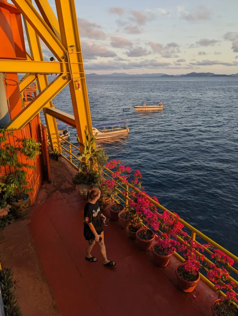 Justyn walking on the main deck of the Seaventures Dive Rig at sunrise.