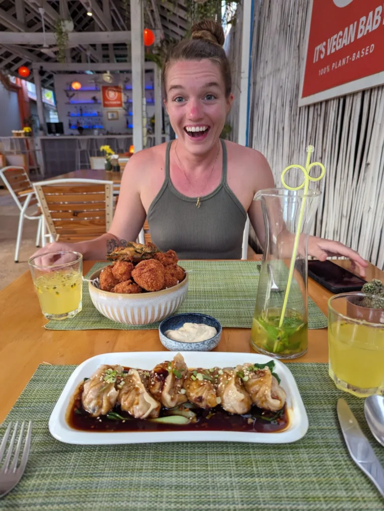 Justyn eating at Hey Bong! Vegan restaurant in Siem Reap.