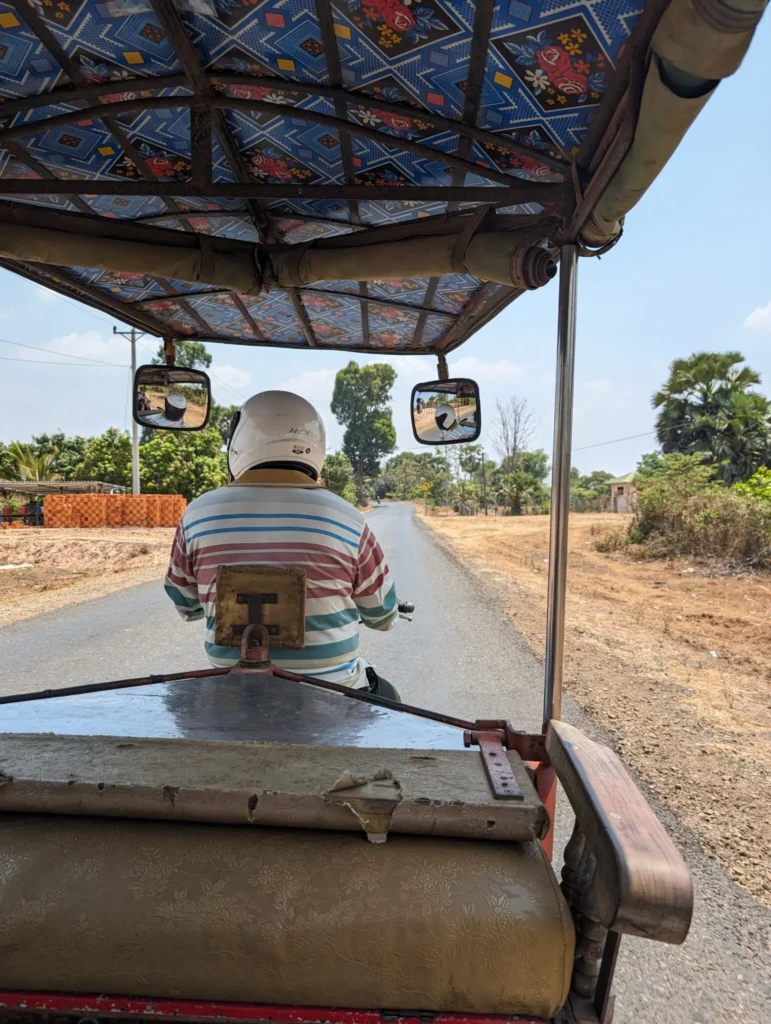 Sitting in the back of a tuktuk adventuring in Cambodia.