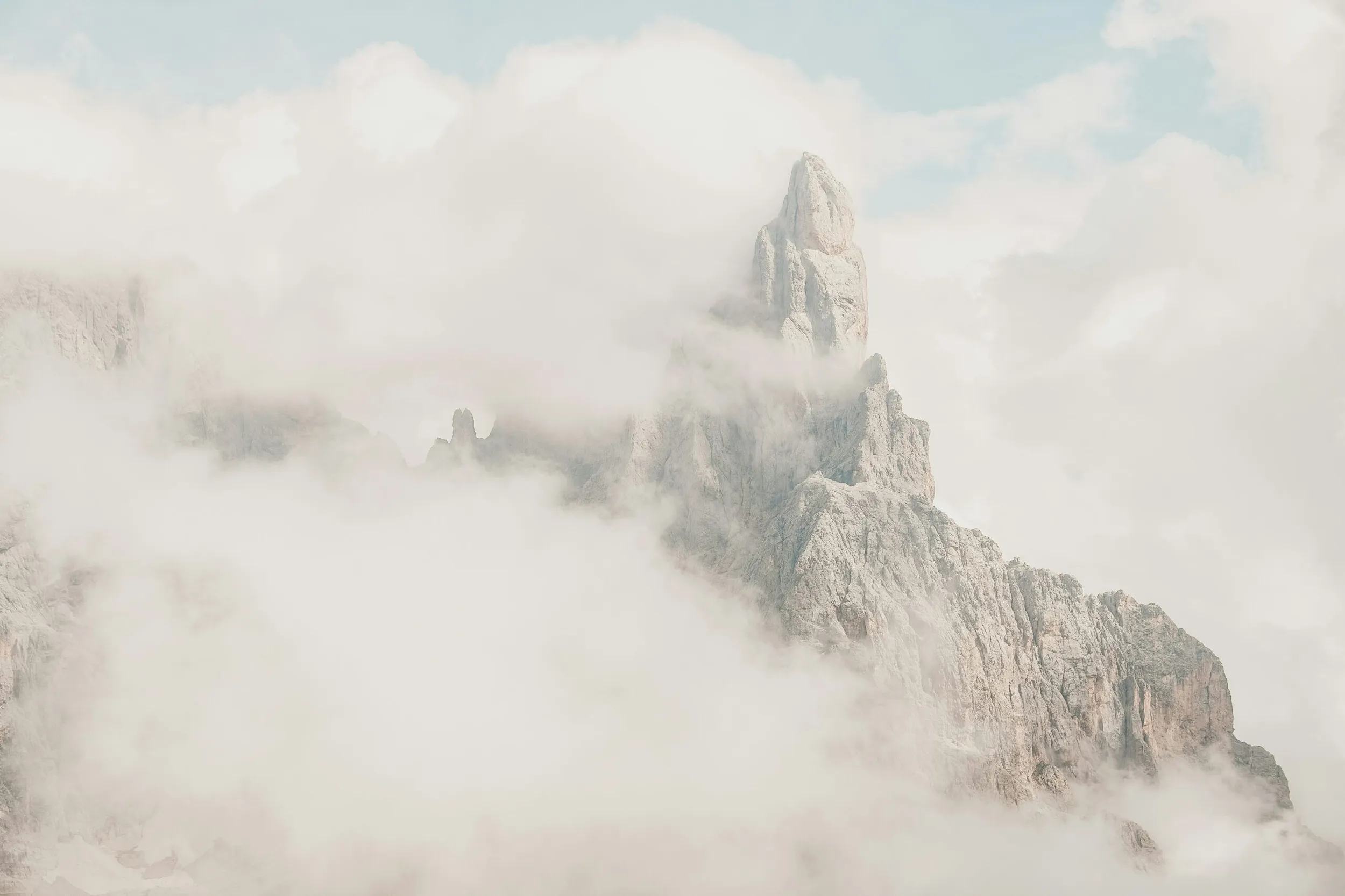 The Dolomites behind clouds.