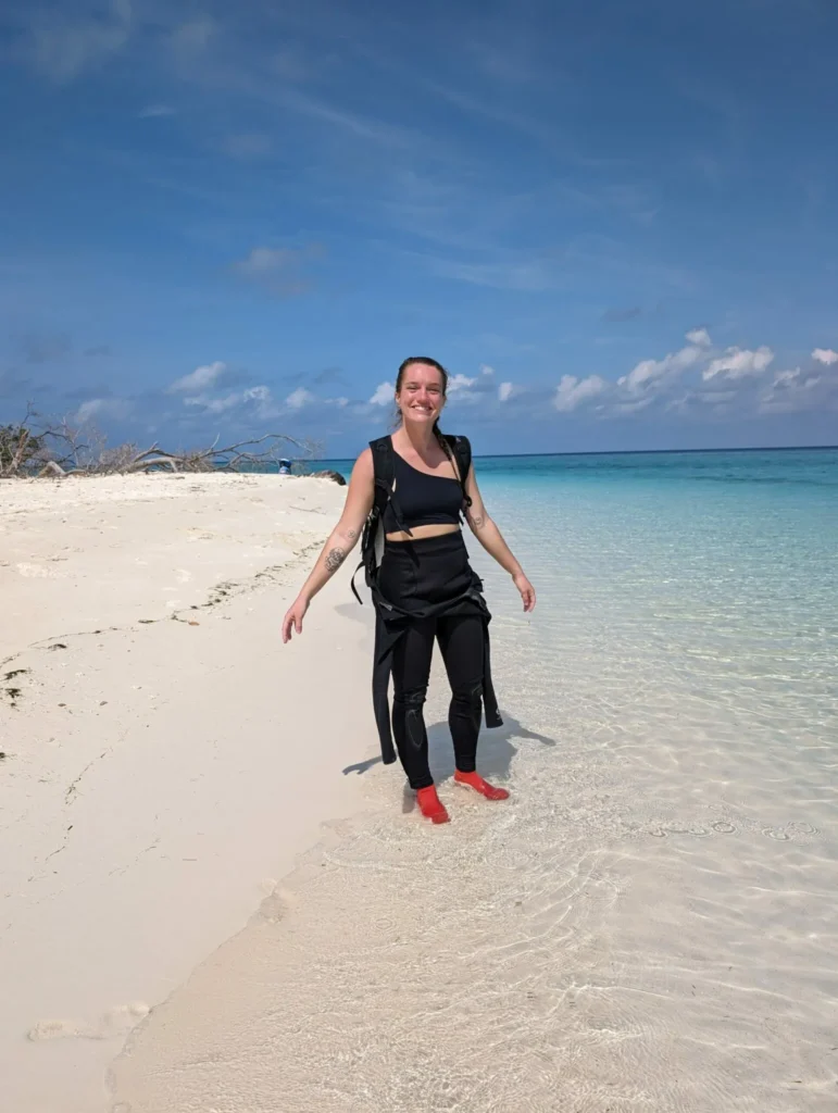 Justyn standing in the sand at Sipadan Island between dives.