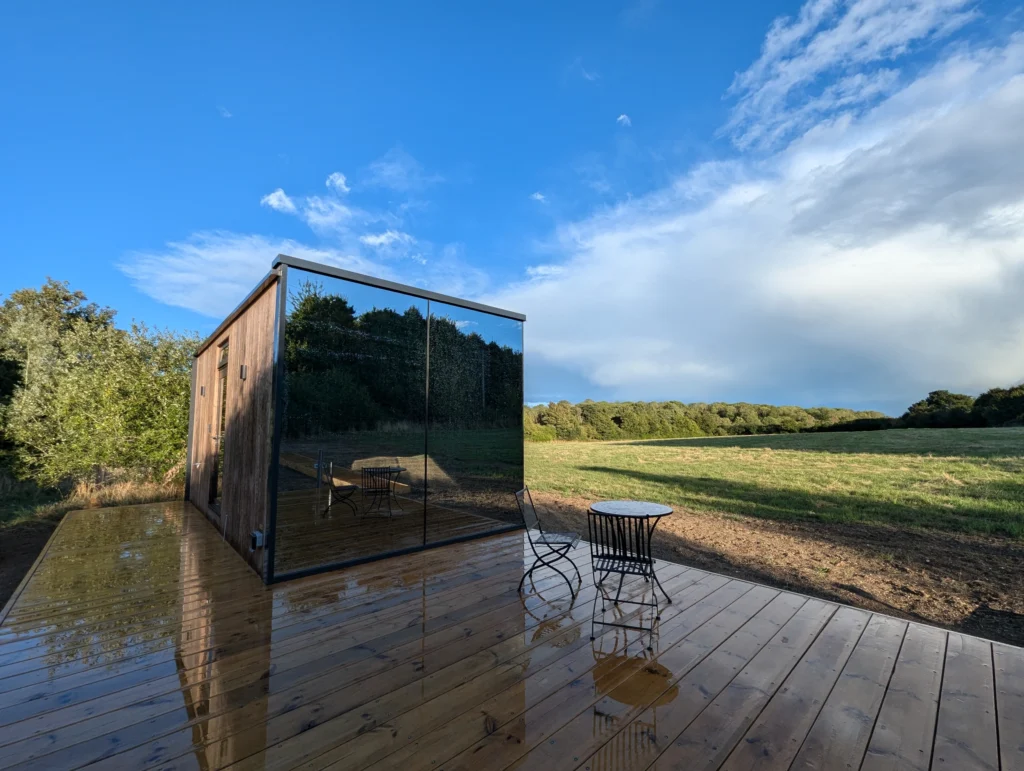 OOD Mirror House: Pound Farm - Meadow on a blue sunny day.